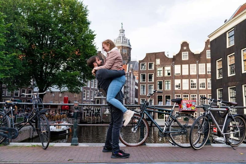 Amsterdam Canals Photoshoot: Private Solo, Family or Couples - Where You Meet on Damrak: Prins Hendrikkade and the Central Station Flag