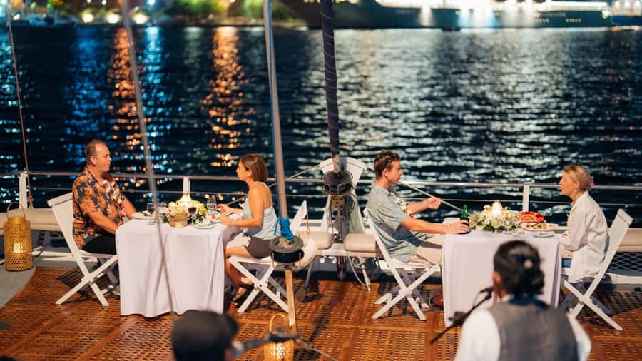 Bali/Benoa: 5-Course Romantic Evening Cruise With Live Music - Your welcome starts at Benoa Bay: drink, lei, then live music