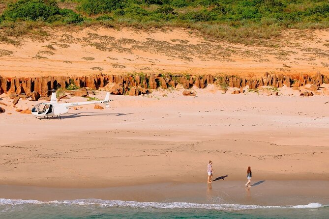 Broome: Romantic 45-Min Private Helicopter Flight & Beach Picnic - Town Beach, Roebuck Bay color bands, and Dampier Creek patterns from the sky