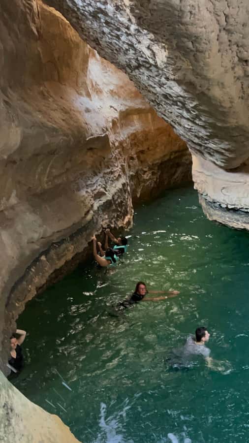 Muscat: Wadi Shab, Romantic Cave and Sinkhole Full-day Trip - The quick boat ride and the Romantic Cave stop (the heart-shaped photo moment)