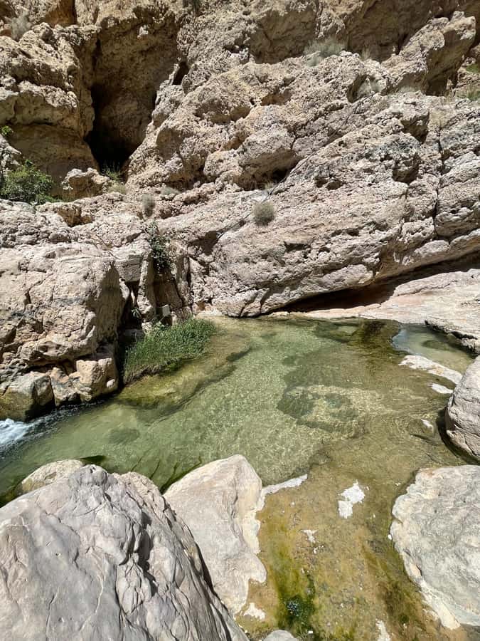 Muscat: Wadi Shab, Romantic Cave and Sinkhole Full-day Trip - Bimmah Sinkhole: a different kind of swim stop with a photo-and-sunset feel