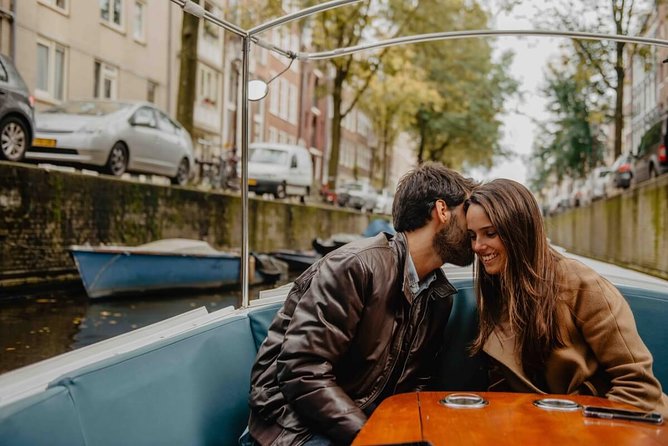 Private Romantic Canal Cruise Amsterdam with Bubbly and Snacks - From Amstel to love-focused art: Circus theatre and Bridge of Love
