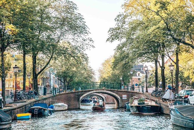 Private Romantic Canal Cruise Amsterdam with Bubbly and Snacks - Medieval tower, old harbor hope, and the shortest canal