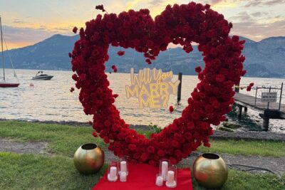 Romantic Marriage Proposal Experience in Lake Garda - The Proposal Moment: Sign, Candles, and a Planner on Cue