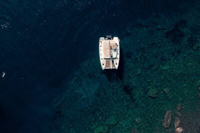 Romantic Sunset Catamaran Caldera Cruise incl. Meal & Drinks - Where You Start: Marina of Vlychada, Red Beach Views, and Short Stop Time