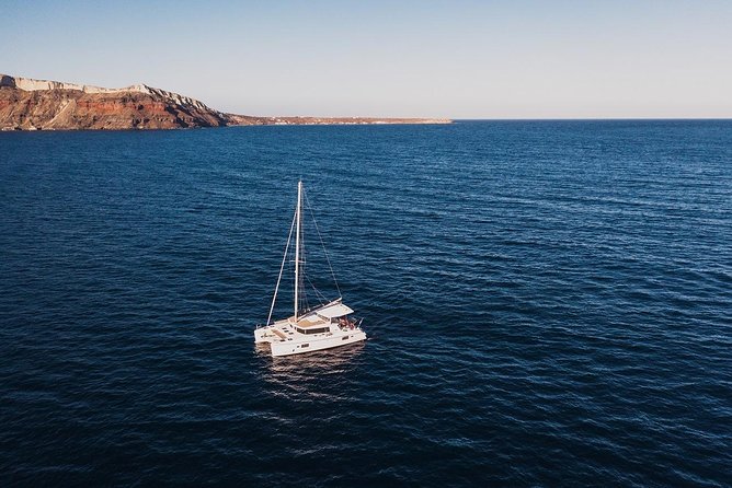 Romantic Sunset Catamaran Caldera Cruise incl. Meal & Drinks - Dinner and Drinks: Greek BBQ, Open Bar Rules, and What’s Included
