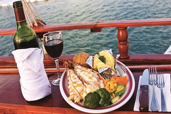 Romantic Sunset Dinner Cruising Experience - Dinner on the water: Lobster, steak, veggies, and portions