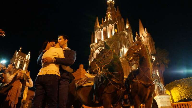 San Miguel: Romantic Horseback Riding at Sunset - Colonia San Antonio at night: colorful streets and a church moment