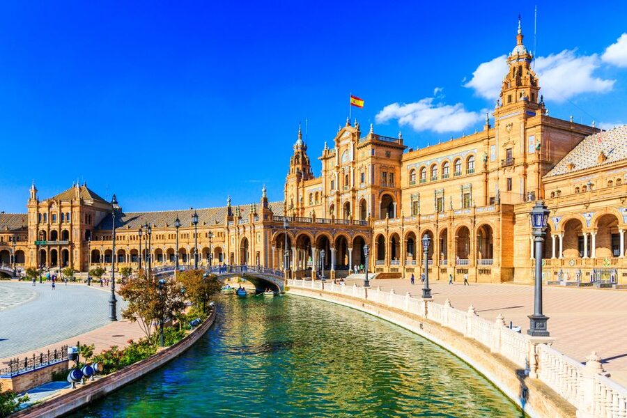 Seville: Authentic and Romantic Horse-Drawn Carriage Ride - The Guadalquivir Riverside and Hotel Alfonso XIII Views