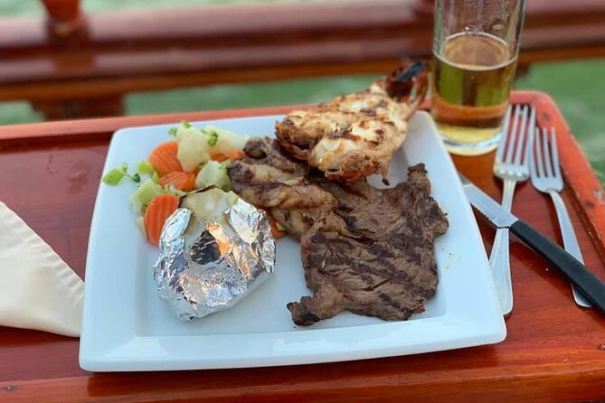 Your Romantic Dinner in Cancun, includes national open bar and live music - Dinner menu choices: lobster, steak, surf and turf, and vegetarian